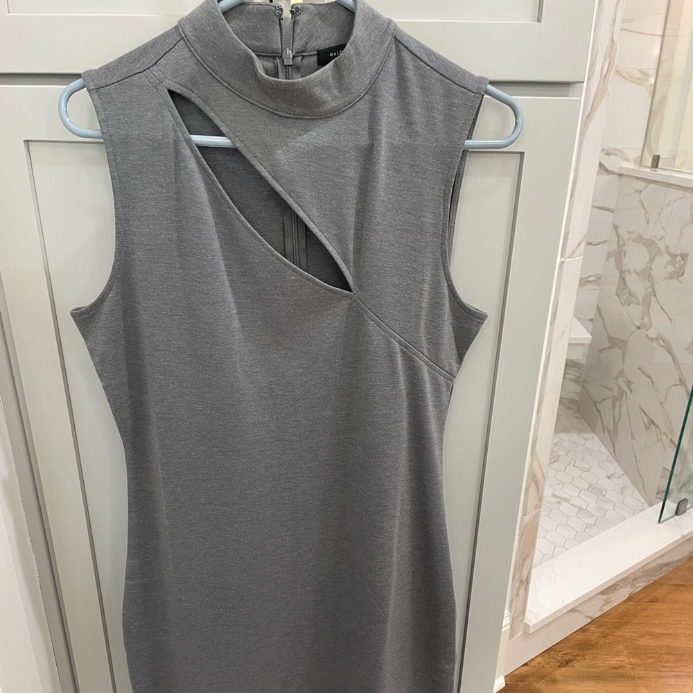 Grey midi length dress with slit at chest.  Never worn.